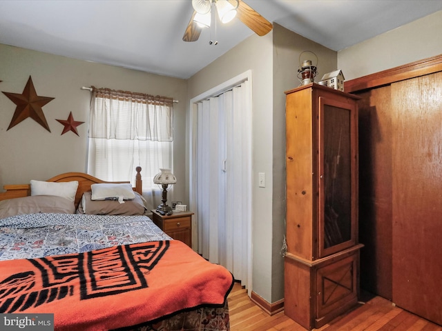 bedroom with ceiling fan and light wood-type flooring