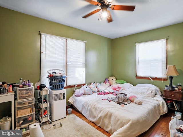 bedroom featuring ceiling fan and hardwood / wood-style floors