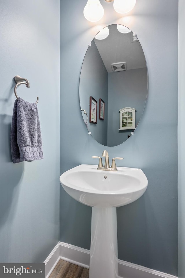 bathroom featuring sink and hardwood / wood-style flooring