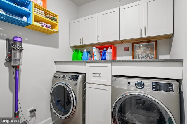 laundry room with washer / clothes dryer and cabinet space