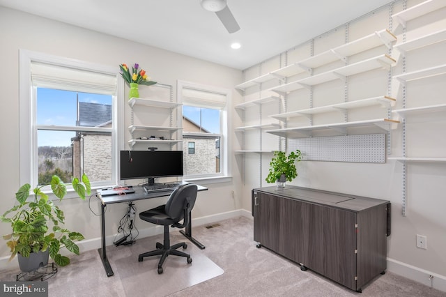 office with light carpet, ceiling fan, and baseboards