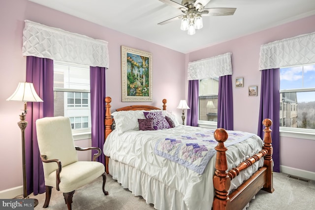 bedroom featuring light colored carpet and ceiling fan