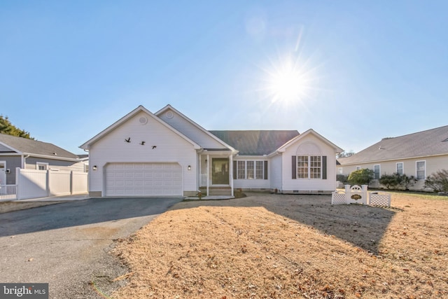 ranch-style house featuring a garage