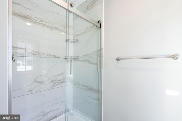 bathroom featuring an enclosed shower