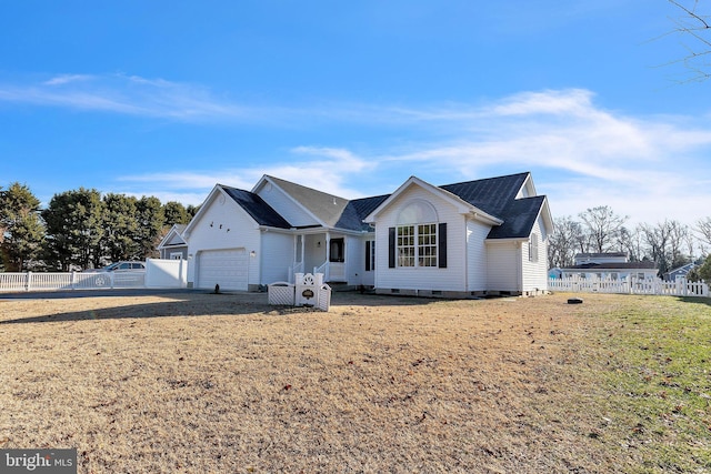 view of front of property featuring a garage and a front yard