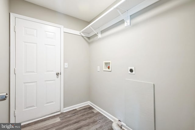 washroom with hardwood / wood-style flooring, hookup for an electric dryer, and hookup for a washing machine