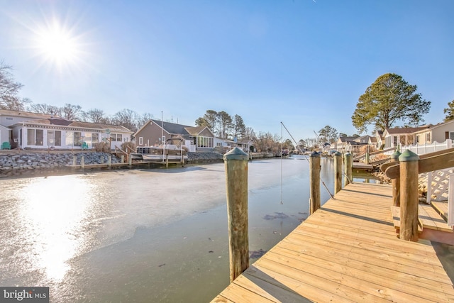 dock area with a water view