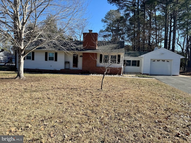 ranch-style home with a garage and a front lawn