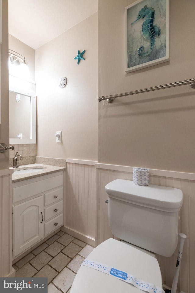 bathroom featuring vanity and toilet