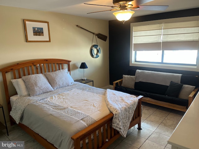 tiled bedroom with ceiling fan