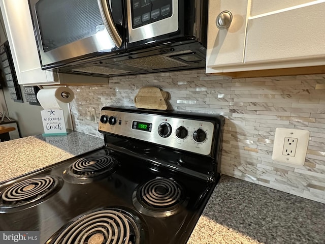 kitchen with tasteful backsplash, appliances with stainless steel finishes, and stone counters