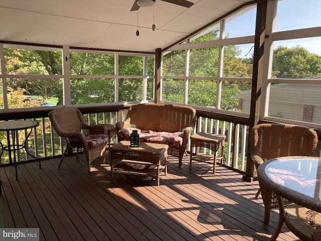 sunroom / solarium featuring vaulted ceiling and ceiling fan