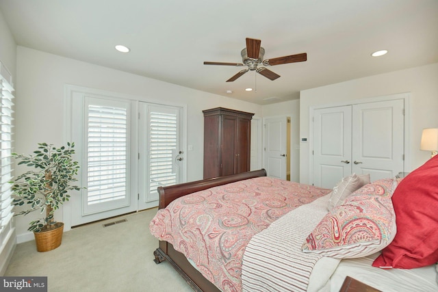 carpeted bedroom featuring access to exterior, ceiling fan, and a closet