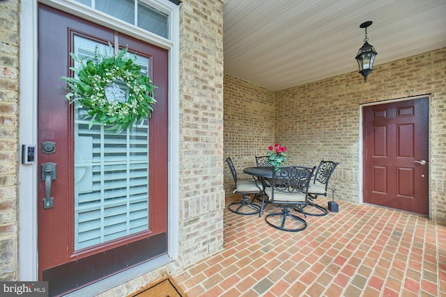 view of exterior entry with covered porch