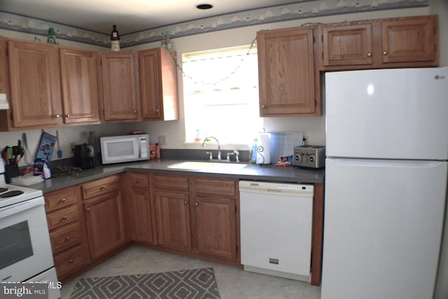 kitchen with sink and white appliances