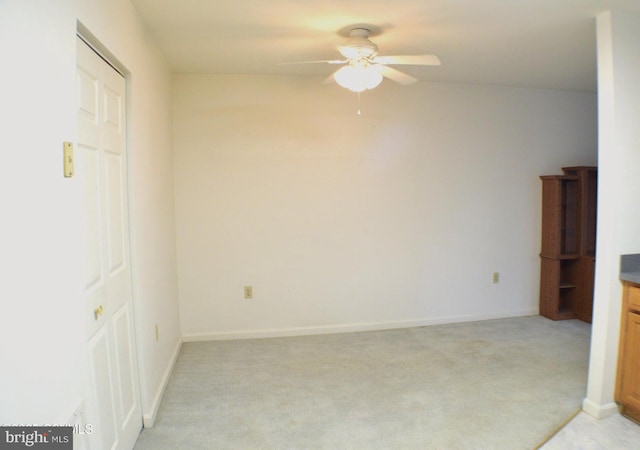 interior space with ceiling fan