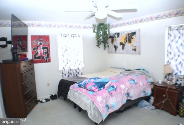 bedroom featuring ceiling fan and carpet floors