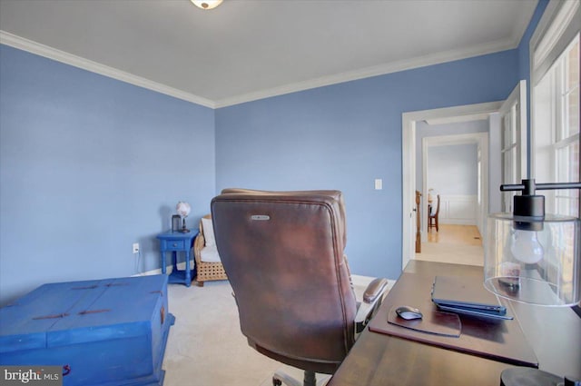 home office with ornamental molding and light colored carpet