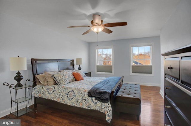 bedroom featuring dark hardwood / wood-style floors and ceiling fan