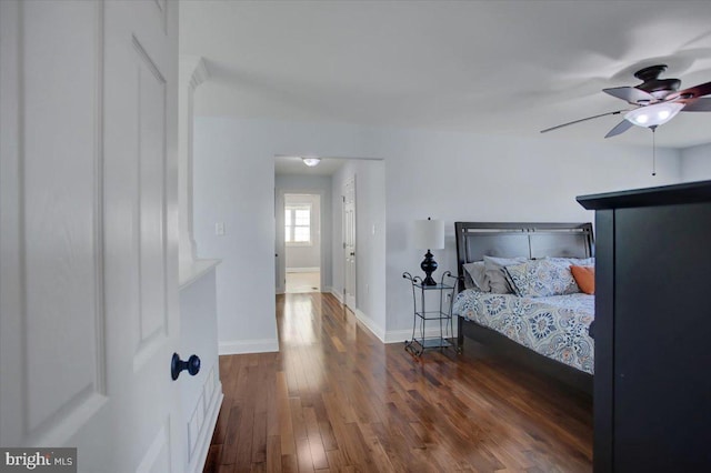 bedroom featuring dark wood-type flooring and ceiling fan