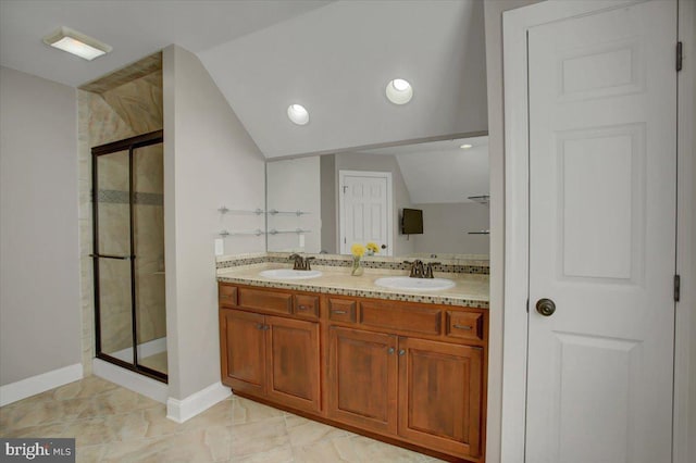 bathroom featuring vanity, an enclosed shower, and vaulted ceiling