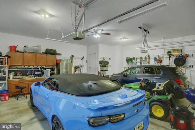 garage featuring a garage door opener and stainless steel fridge