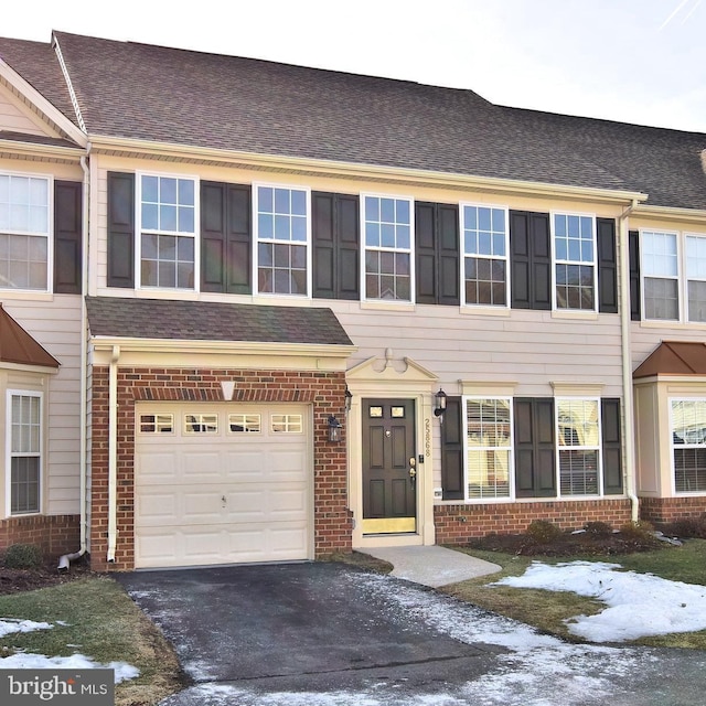 multi unit property featuring a garage