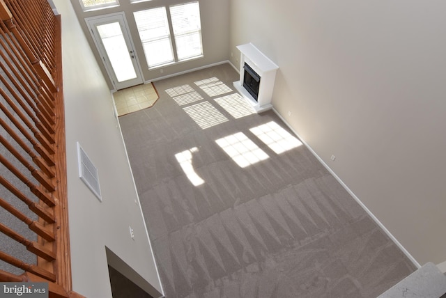 unfurnished living room featuring carpet floors