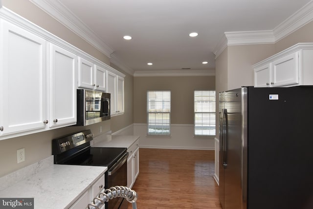 kitchen with white cabinetry, stainless steel appliances, dark hardwood / wood-style floors, and light stone countertops