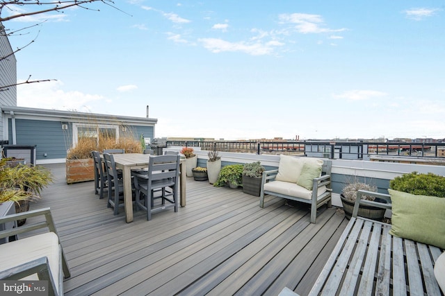 wooden deck with outdoor dining area