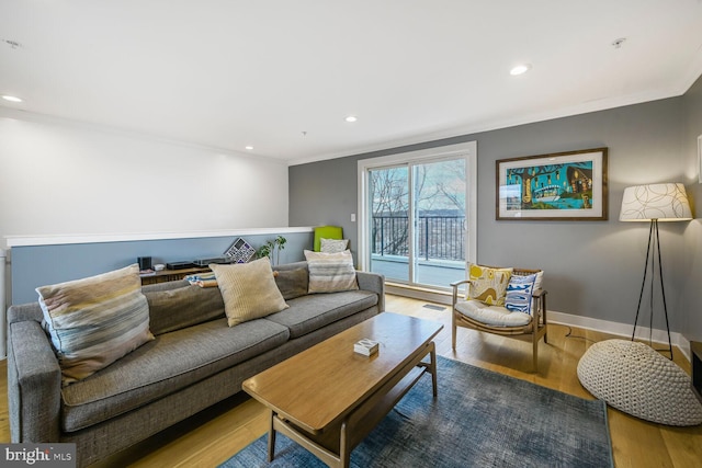 living room with recessed lighting, crown molding, baseboards, and wood finished floors