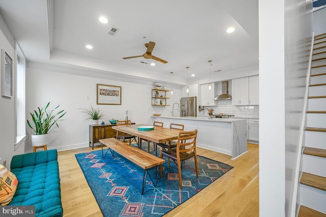 dining space featuring a ceiling fan, recessed lighting, light wood-style floors, and visible vents