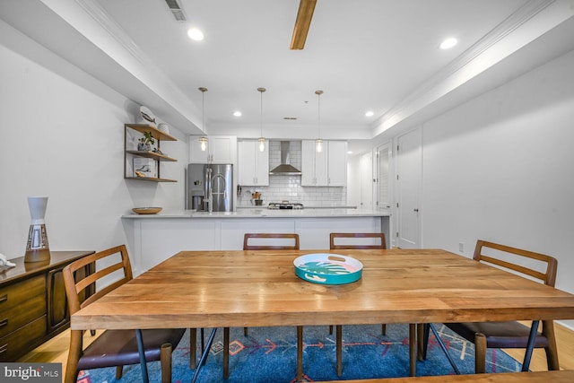 dining room with recessed lighting, visible vents, and ornamental molding