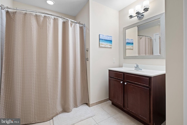 bathroom with tile patterned flooring, vanity, and a shower with curtain