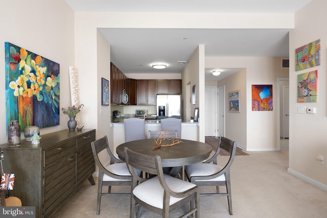 view of carpeted dining room