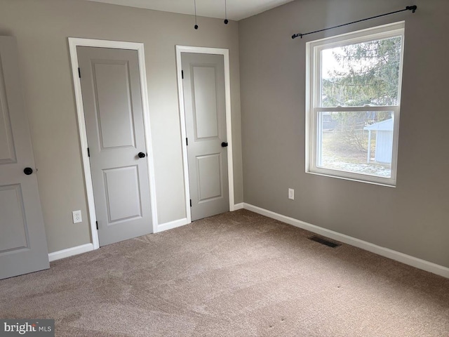 unfurnished bedroom featuring carpet