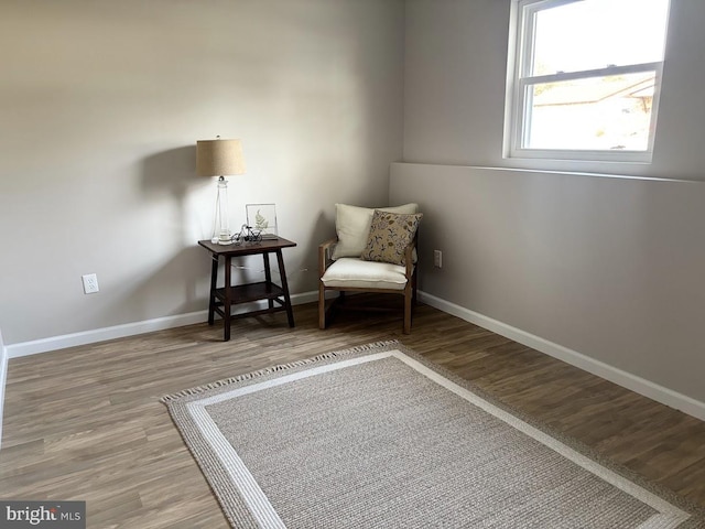 living area with hardwood / wood-style floors