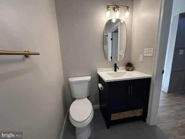 bathroom with vanity and toilet