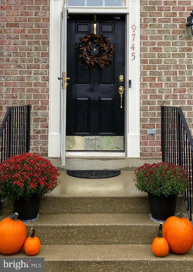 entrance to property with brick siding