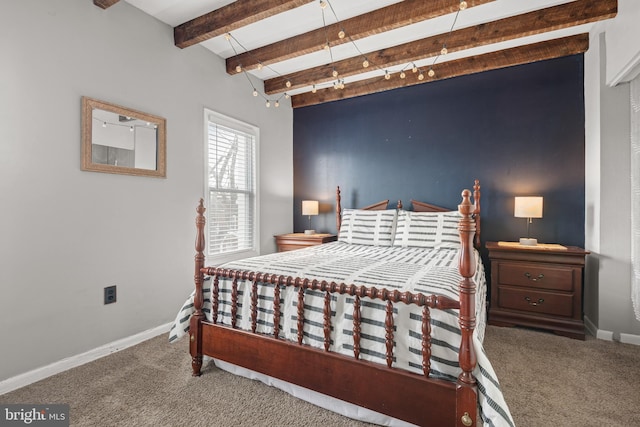 bedroom featuring carpet floors and beam ceiling