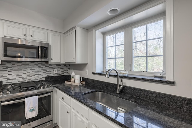 kitchen featuring white cabinetry, appliances with stainless steel finishes, and sink