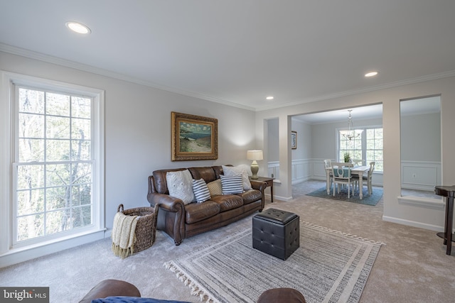 carpeted living room featuring crown molding