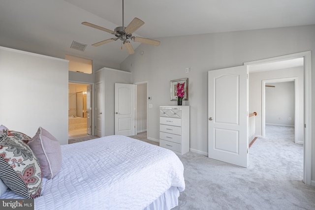 bedroom with ceiling fan, light colored carpet, ensuite bathroom, and high vaulted ceiling