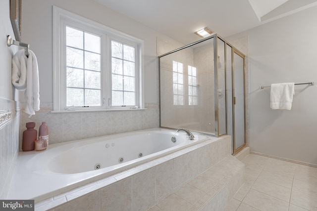 bathroom featuring tile patterned floors and separate shower and tub