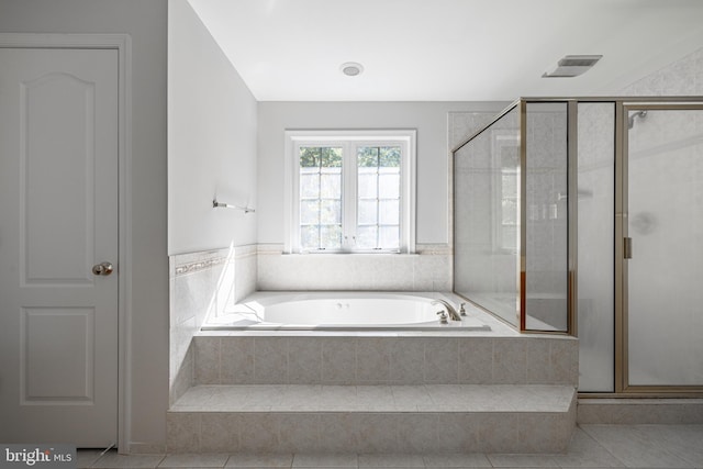 bathroom featuring independent shower and bath and tile patterned floors