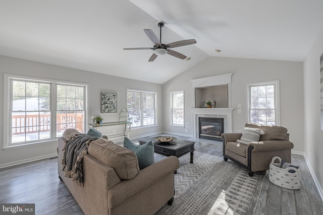 living room with lofted ceiling, a healthy amount of sunlight, hardwood / wood-style floors, and ceiling fan