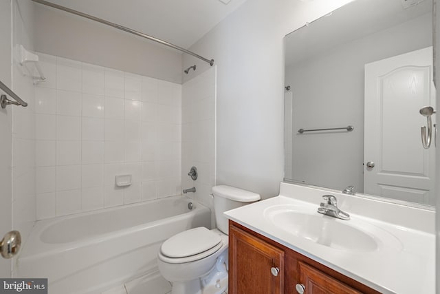 full bathroom with vanity, tiled shower / bath combo, and toilet