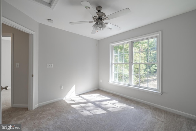 carpeted empty room with ceiling fan