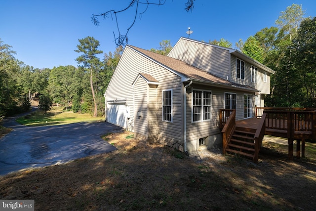 view of side of property featuring a deck