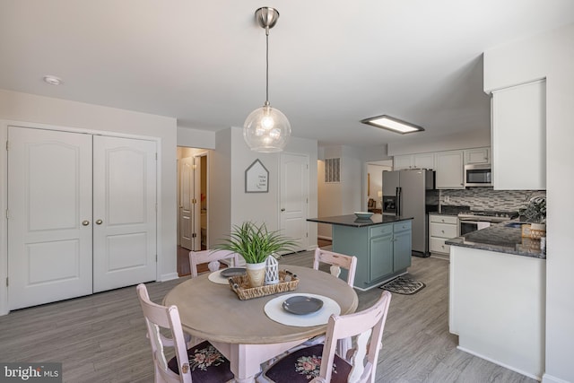 dining room featuring light hardwood / wood-style floors